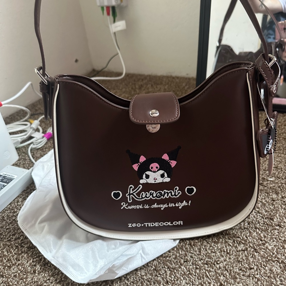 Genuine leather Sanrio bag with matching wallet.